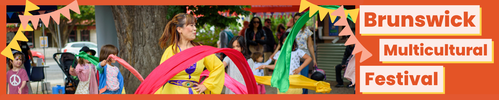 Children dancing with coloured ribbons at the Brunswick Multicultural Festival